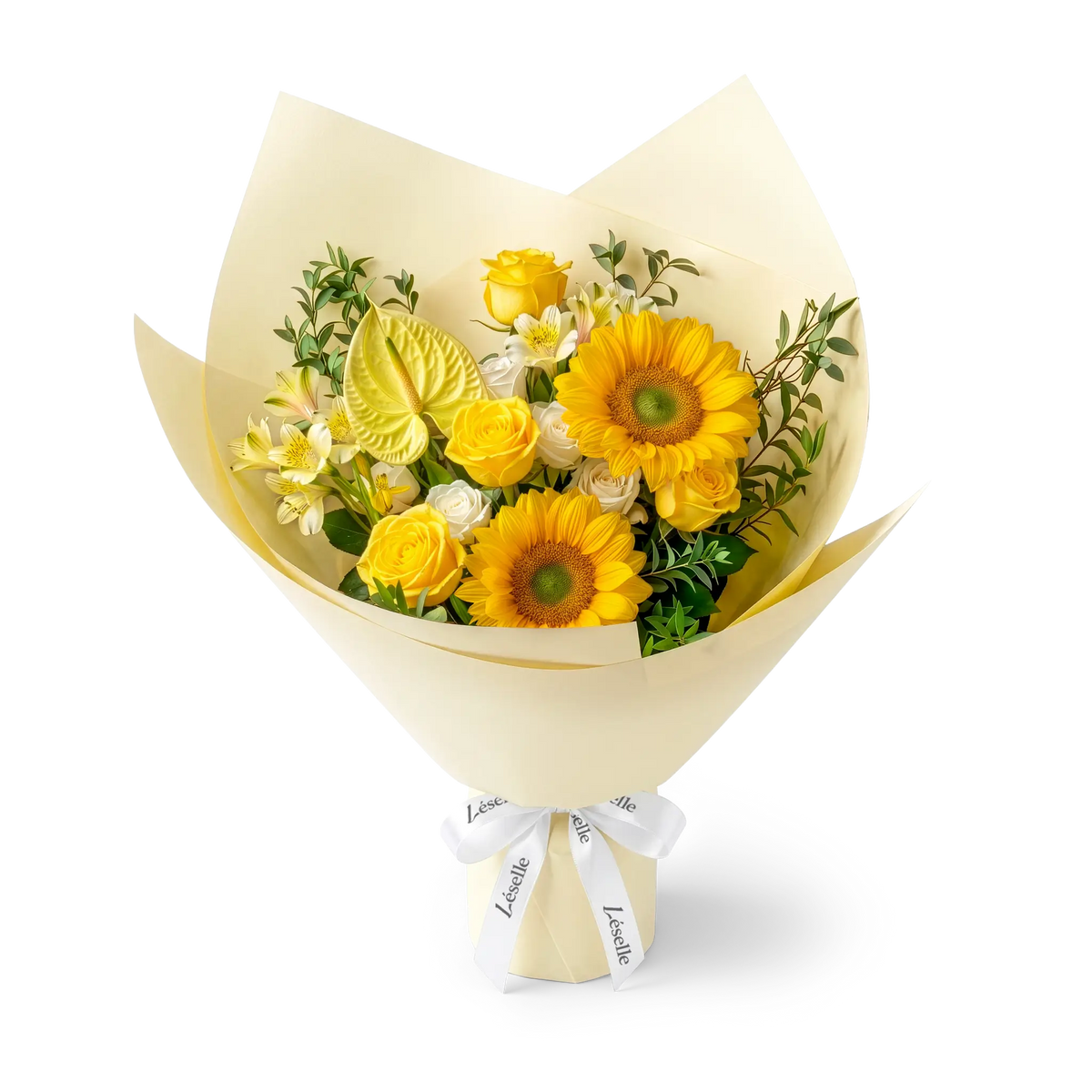 A wrapped flower bouquet featuring green-heart sunflowers, yellow roses, a yellow anthurium, and green foliage, wrapped in a pale yellow paper sleeve with a white ribbon, on a transparent background.